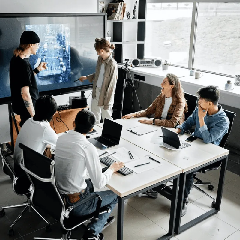 Illustration of the SARA Tech team collaborating around a screen